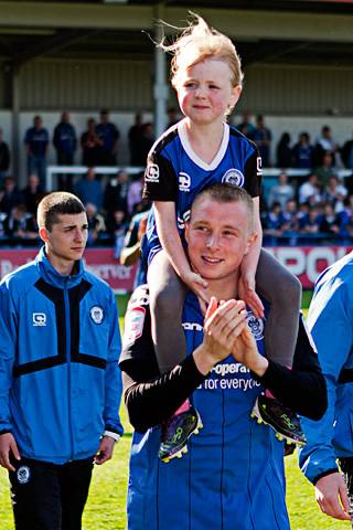 Nicky Adams with his daughter on the lap of honour