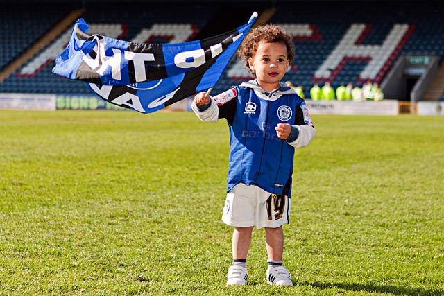 The lap of honour complete all the players and supporters have left but O'Grady junior continues to fly the Dale flag