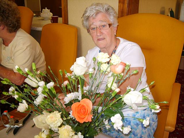 Tenants at the Fieldway scheme make their own hand tied fresh flower arrangement 