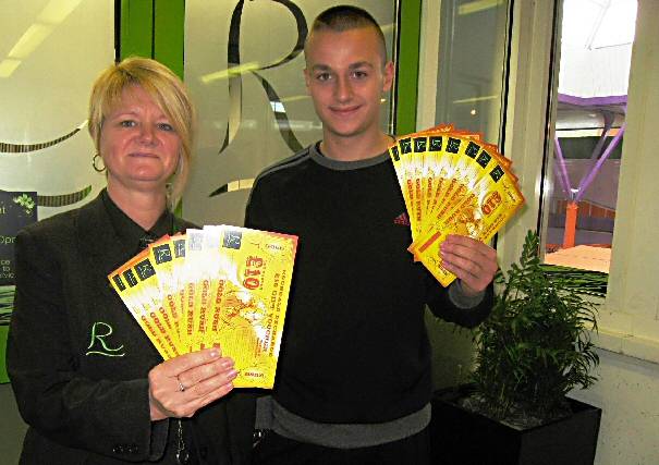 Michele Storey, Centre Ambassador presenting Ross with his Gold Rush vouchers.
