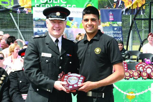 Summander Hussain receiving an award at the annual UPS Passing Out Parade last summer