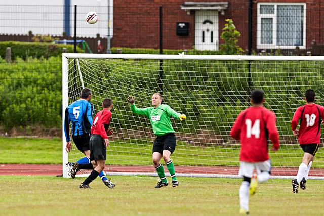 Asif Khan lobs the Police keeper for the opening goal<br \>Annual Alliance Football Match<br \>
Police (Rochdale Division) versus Sport for All