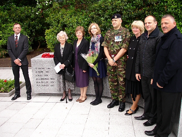 A wreath is laid on the new memorial 

