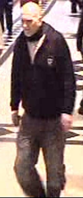 CCTV image of a man who racially abused and attacked a passerby 