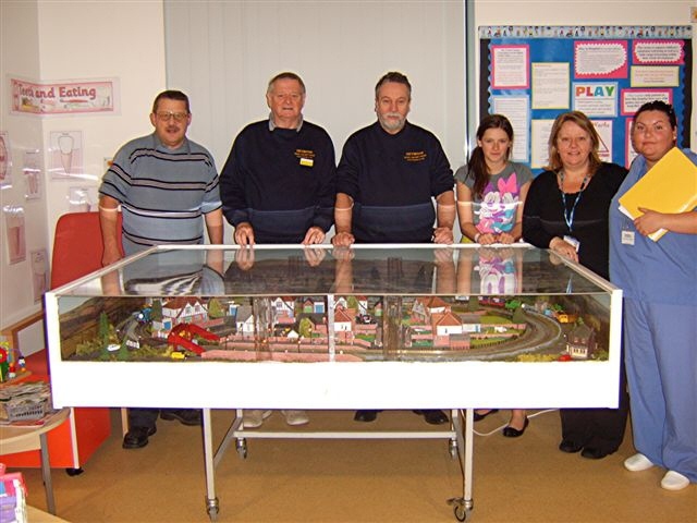 Mr Alldritt with members of the Heywood Model Railway Group and staff from the Children's Ward