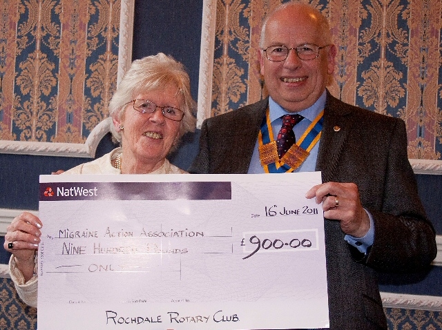 Mary Ayres recieves a cheque from John Cannell