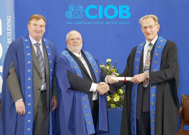 Kieren McDonnell, Operations Directors and Graham Jackson, Managing Director, receiving the CIOB certificate. 
