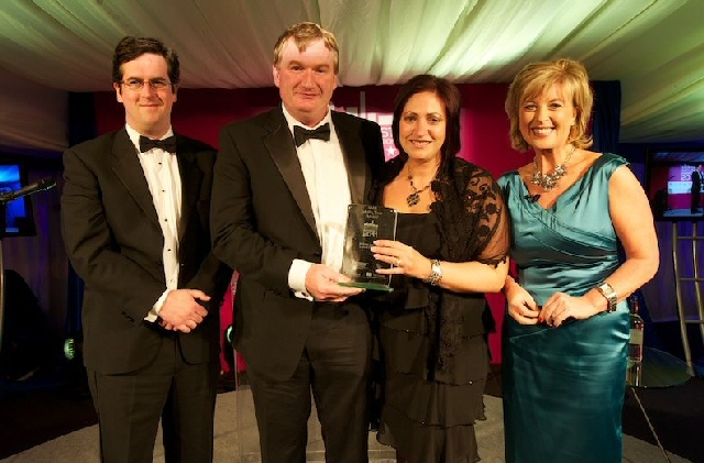 Operations Director Kieren McDonnell and Finance Director, Helen Senior from Jackson, Jackson & Sons collect the SME of the year award from Lucy Meacock at the Regional Construction Awards
