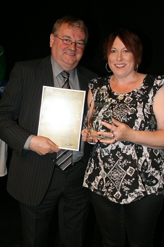 Rochdale FC Chairman Chris Dunphy presenting the Club of the Year Award to a representative from the Rochdale Company of Archers