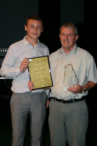 Cameron Foster presenting the Unsung Hero award to Maurice Clarke