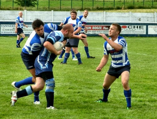 Simon Moore working hard in defence in the Charity Cup Final