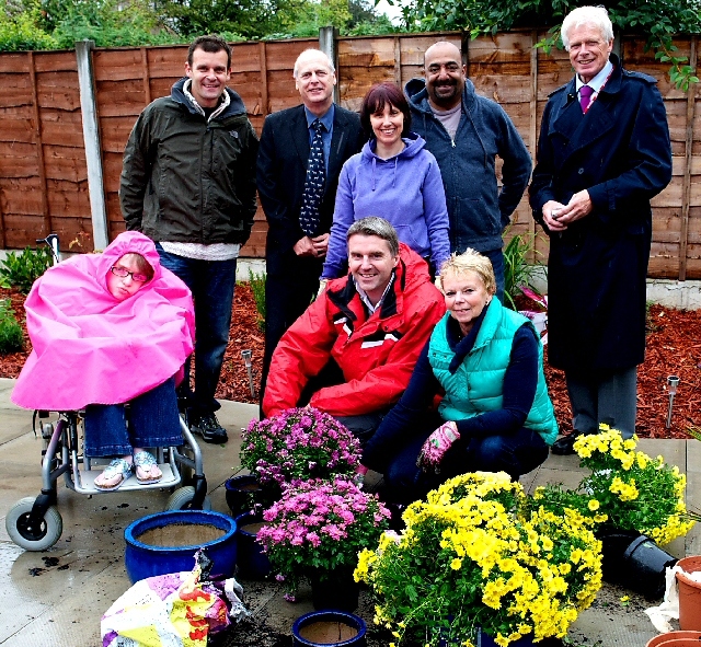 Nicole Fitton is pictured with members of The Co-operative Pharmacy’s senior team who have transformed her garden.
