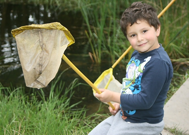 Six-year-old Andre Hopcroft having fun at the pond dip