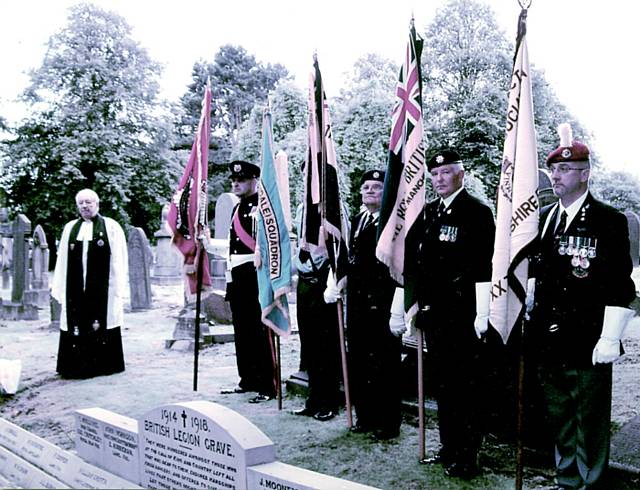 Standard bearers of the Royal British Legion and other organisations at the rededication service of the British Legion War Grave