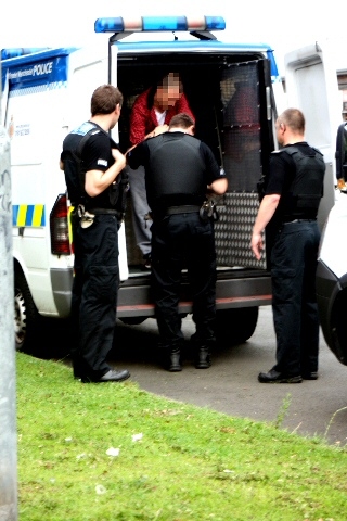 Officer dealing with another suspect 