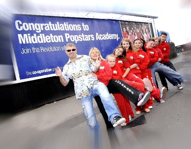 Ian Robinson (Black Lace) leads the Middleton Popstars Academy conga.
