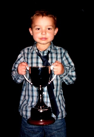 Riley with his trophy from the transplant games 