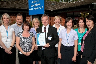 Pennine Acute Trust’s occupational health team proudly displays their SEQOHS certificate of accreditation