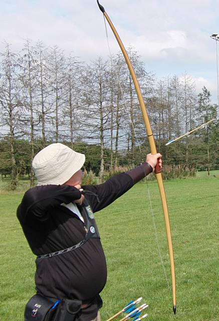 Long bow arrow in flight