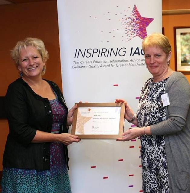 Kelso Peel (right), Head of KS4 at Redwood School, receives its award from Wendy Cooke, Greater Manchester 14-19 Assistant Director 

