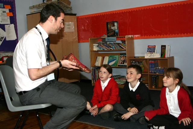 Year 4 children listening to a story about Cinderella 