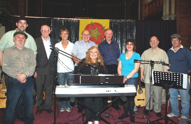 'Lanky Neet' line up: Vocalist Pat Fisher (keyboard) flanked by (left to right) Tony Bostock, Jamie Harrison (The band 'Gifted'), Roger Halstead, the Rev Sharon Jones, Peter Shrigley, Stuart Carmichael, Sheila Moore (all St Andrew's), Mike Fisher, Gareth Dickinson ('Gifted').

