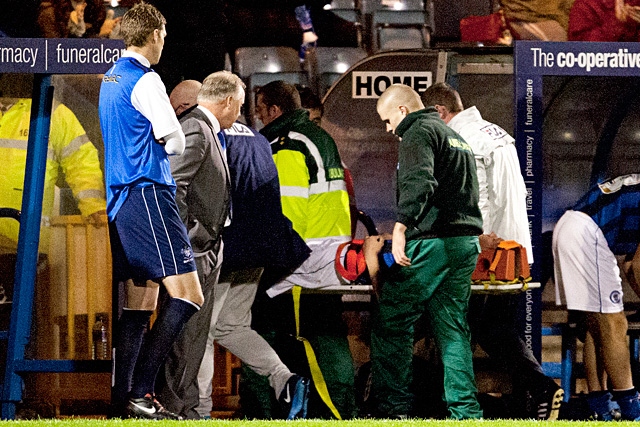 Ryan Edwards leaving the field on a stretcher after a clash of heads with Matt Doherty