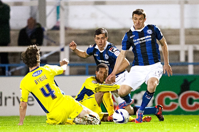 George Donnelly beats Byrne to the ball