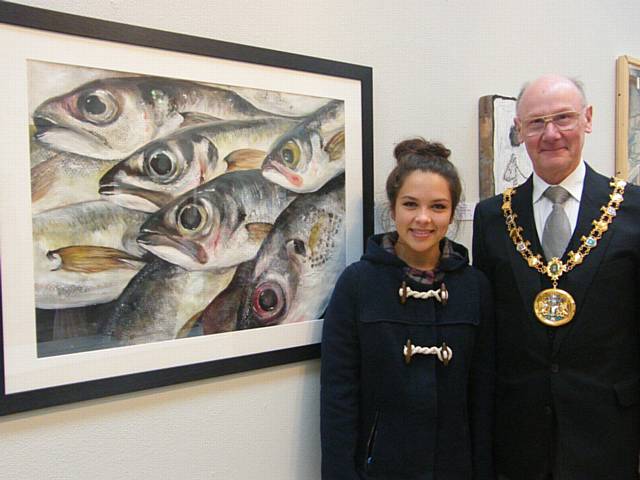 The Mayor with young artist Imogen D’Roza and her mixed media artwork ‘When the Boat Comes In’. Imogen, 19, is now at University studying Graphic Design having originally come to Touchstones Rochdale on work experience and hopes for a future career in the industry. With both parents art teachers, creativity could be described as being in her genes