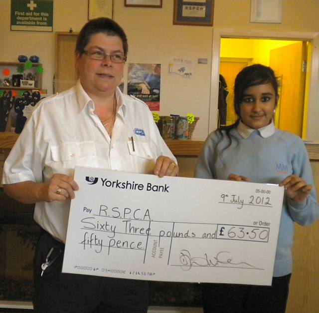 Adeeba presented her cheque for £63.50 to Jean Spencer at the RSPCA Rochdale Branch
