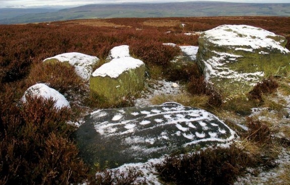 Carved rock in snow by Richard Stroud