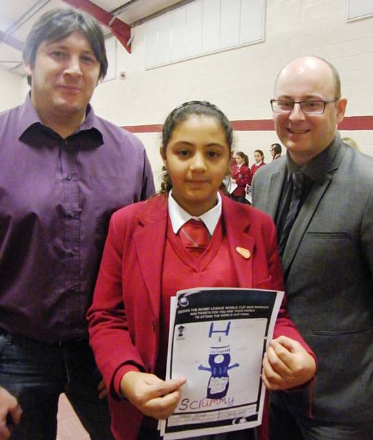 John Stankevitch from Rochdale Hornets and Martin Ballard from the Wheatsheaf Shopping Centre, the Hornets Team sponsor, present Natalie with her prizes