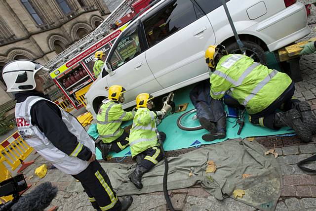 Dramatic stunt staged by the emergency services to highlight the dangers posed to cyclists and bikers straying into the blind spots of HGVs and buses