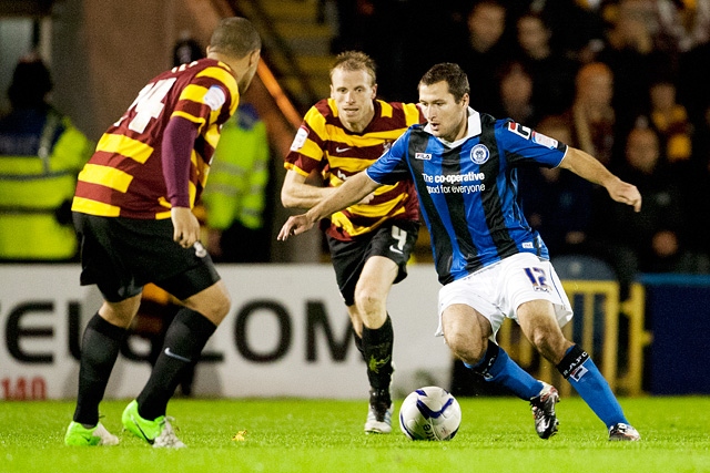 Phil Edwards takes on Kevin McIntrye<br \>Rochdale v Bradford City