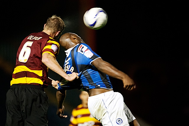 Luke Oliver tries to take the shirt off Dele Adebola's back<br \>Rochdale v Bradford City