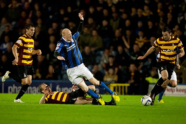 Jason Kennedy gets his legs taken from under him<br />Rochdale v Bradford City