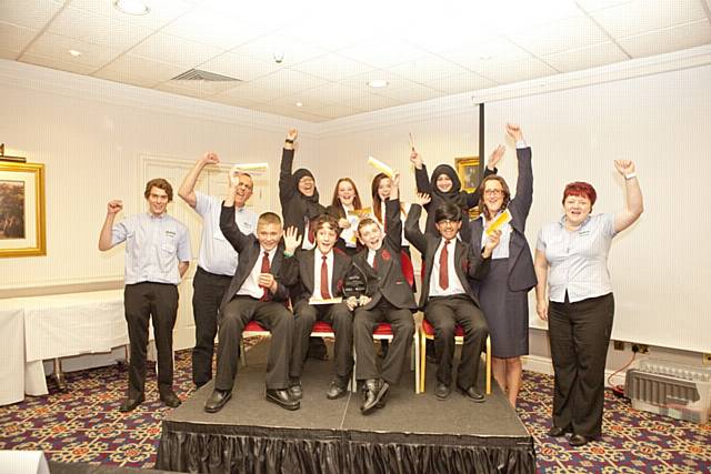 Students from The Radclyffe School, Oldham celebrate their win with McBride managers