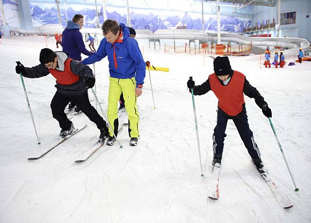 Students from Matthew Moss High School experiencing skiing to get a sense of what it will be like for Lee Houlding and his team when travelling across Antarctica