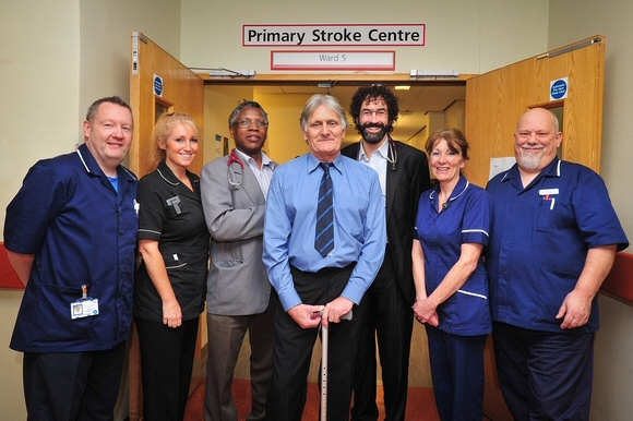 Kevin Griffiths (centre) with the medical team he credits with saving his life. L- R Stuart Greenwood, Charge Nurse A&E, Cath Curley, Stroke Thrombolysis Co-ordinator, Dr Robert Namushi, Stroke Consultant, Kevin Griffiths, Patient, Dr Khalil Kawafi, Stroke Consultant, Denise Knowles, Ward Manager at the Acute Stroke Unit and Stuart Young, Ward Manager for Stroke Rehabilitation.
