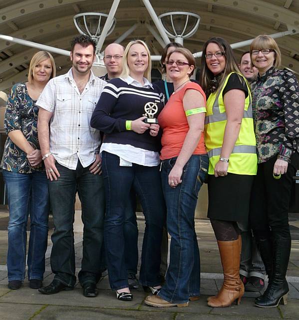 'Cycling Champion’ and Littleborough resident, Caroline Muldowney, is pictured with her TfGM cycling trophy and colleagues