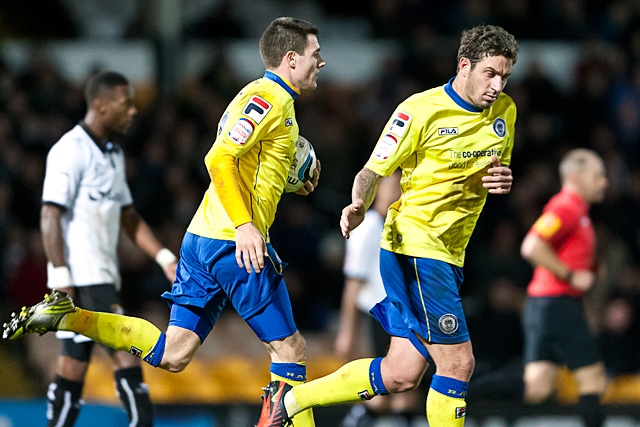 Bobby Grant runs back to the centre circle with the ball following his goal<br \>Port Vale v Rochdale