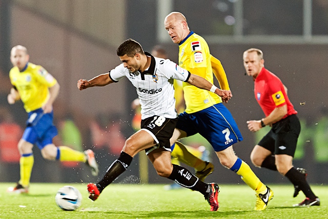 Sam Morsey chased by Jason Kennedy<br \>Port Vale v Rochdale