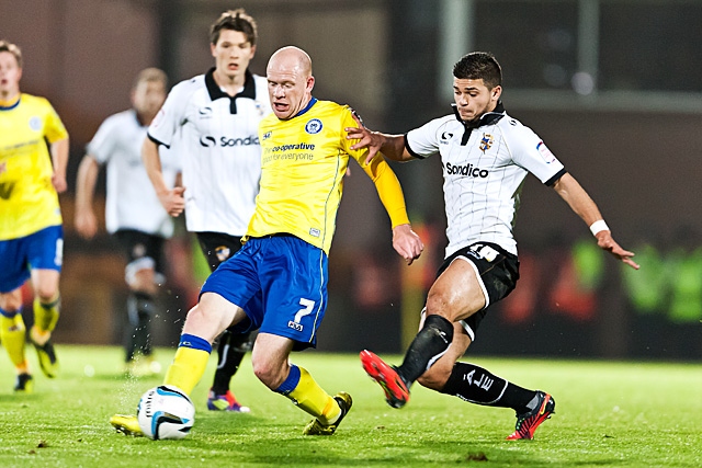 Jason Kennedy challenged by Sam Morsey<br \>Port Vale v Rochdale