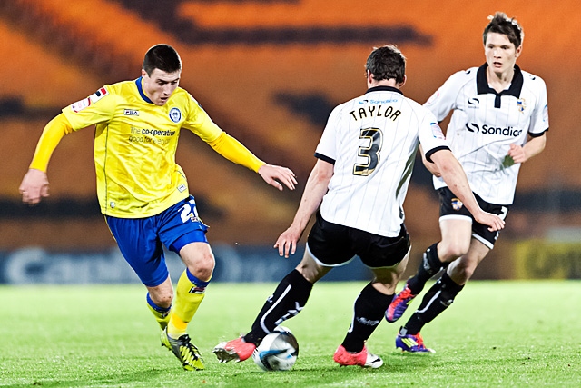 Robert Taylor beats Bobby Grant to the ball<br \>Port Vale v Rochdale