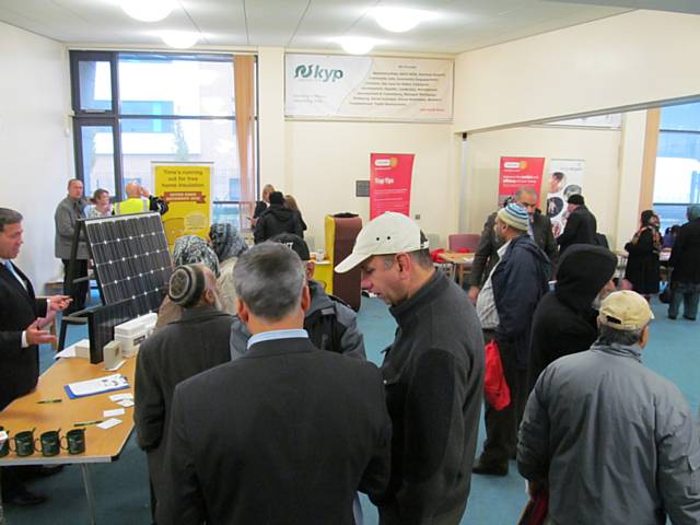 Residents recieving information at the Energy Efficiency Awareness event at KYP 