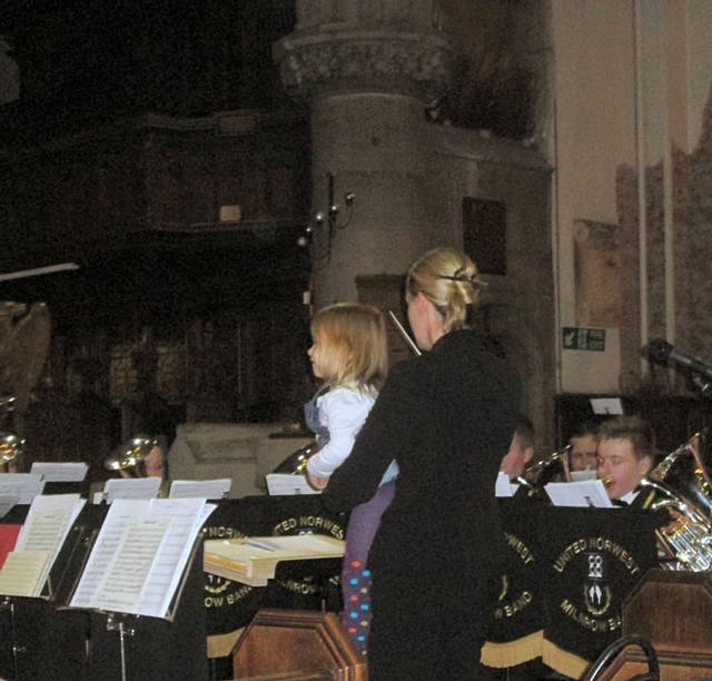 Milnrow Band playing Rudolf the Red Nosed Reindeer in which Musical Director Mareika Gray was assisted in her conducting duties by 3 year old Isla Connell