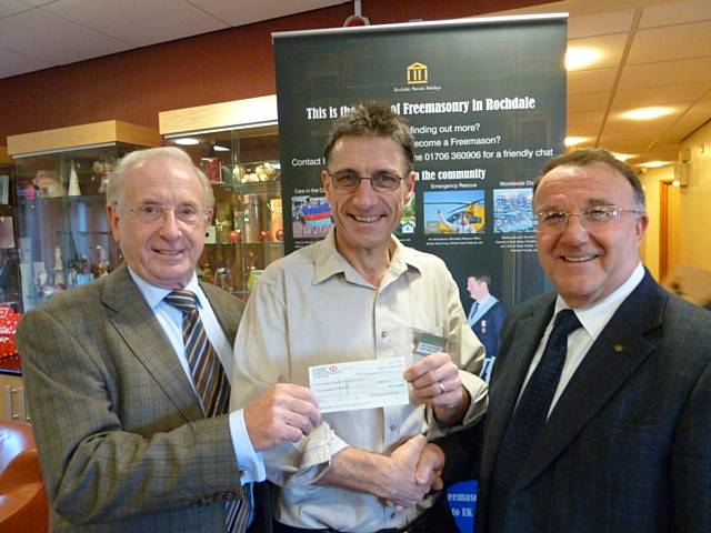 Peter G Hewitt, District Chairman; J Kenneth Davies, MBE, Charity Steward; both from the Rochdale Freemasons with  Jonathan Parris, Chief Executive of Springhill Hospice