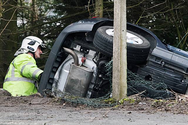 Car leaves road and ploughs down embankment