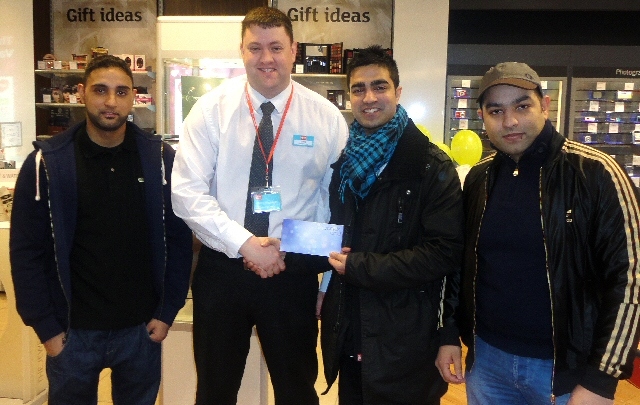 Aspire Generations Group members receiving their voucher from Jamie Balde, store manager of Argos.