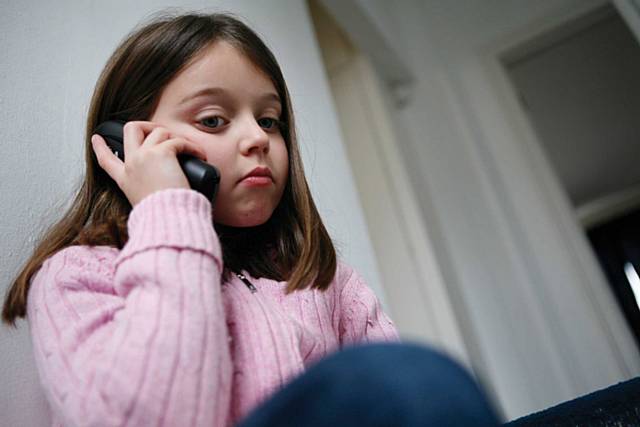 ChildLine - Girl on phone